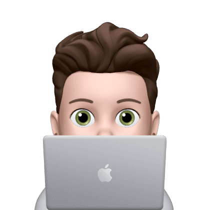 Person peeking from behind laptop